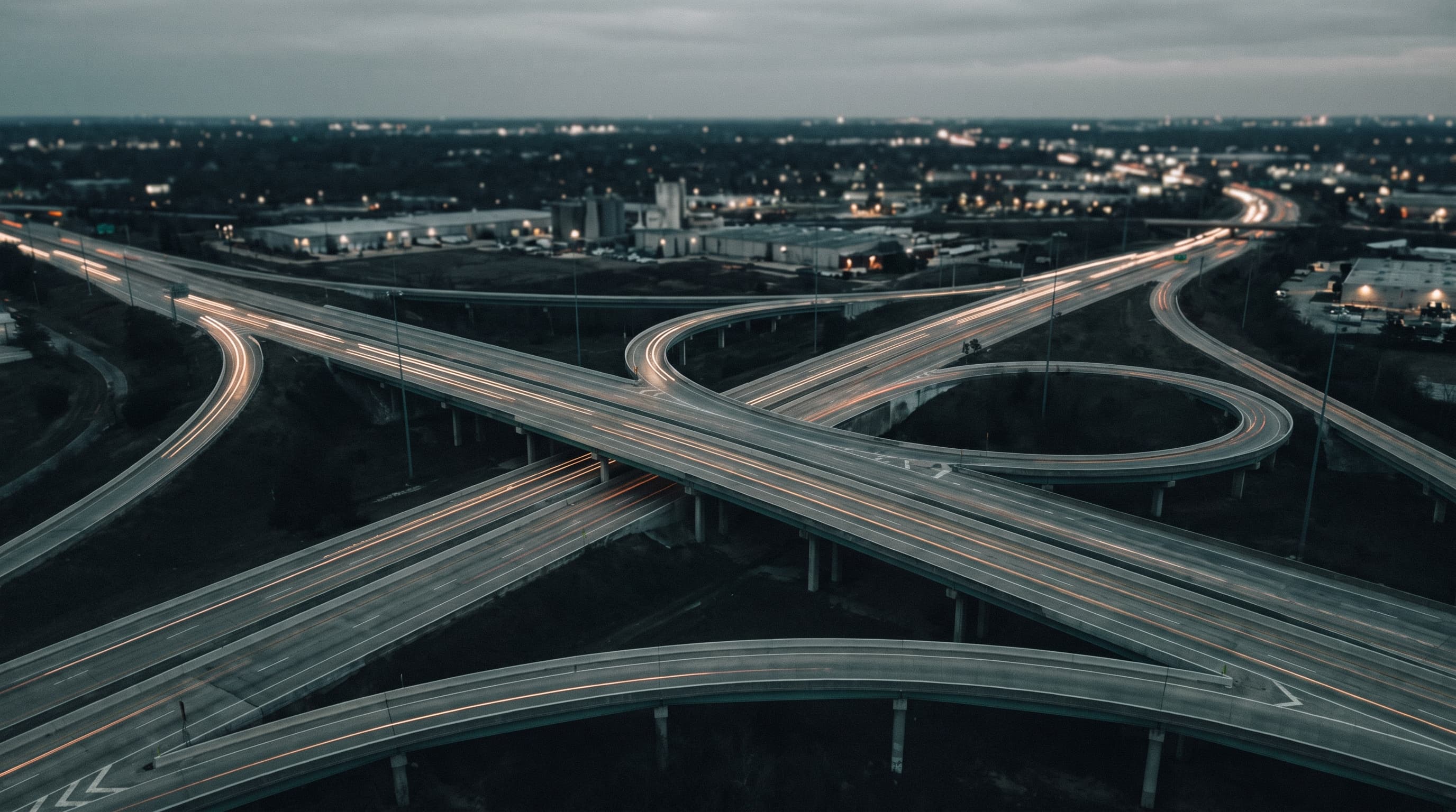 Aerial highway interchange transport network at dusk